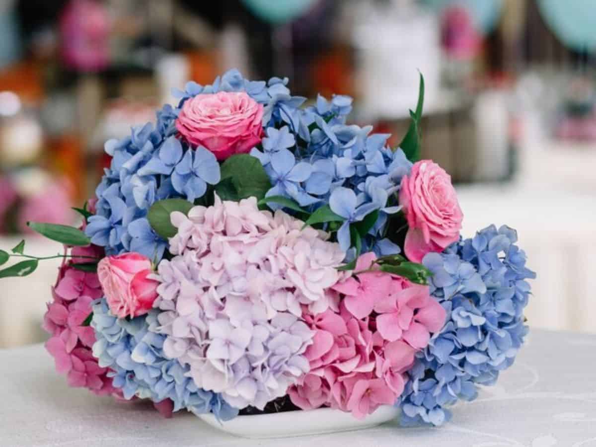 Blush and soft blue hydrangea bouquet as wedding table decor
