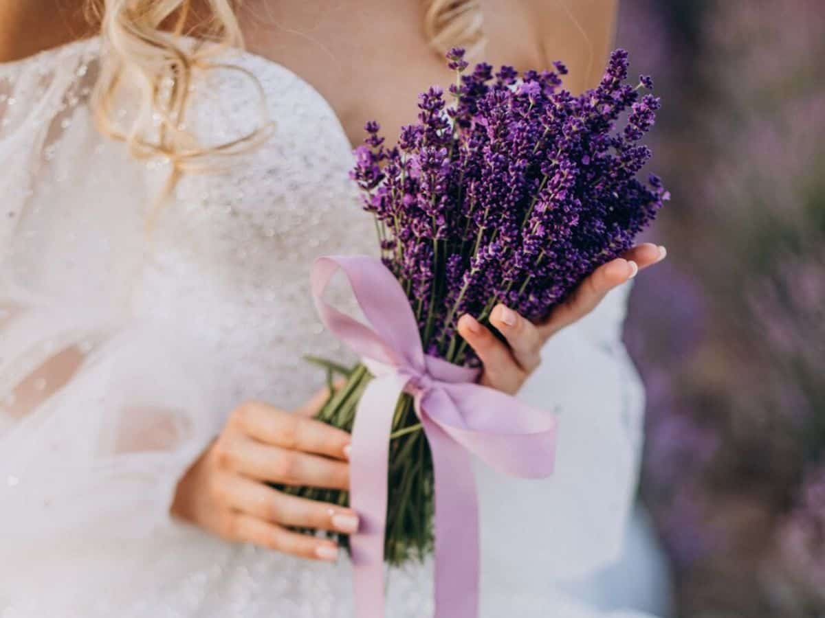 Lavender bouquet held by bride on wedding day