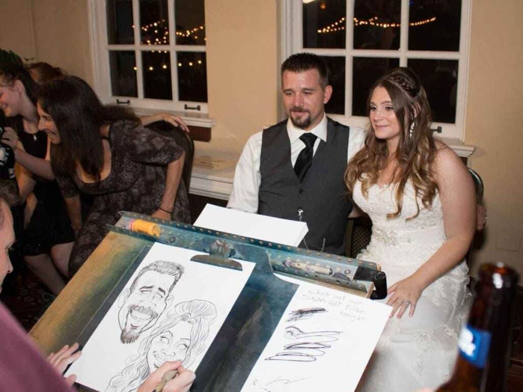 Caricature artist sketching guests