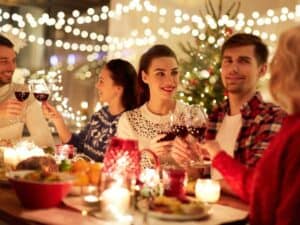 Coworkers enjoying a festive corporate holiday dinner party