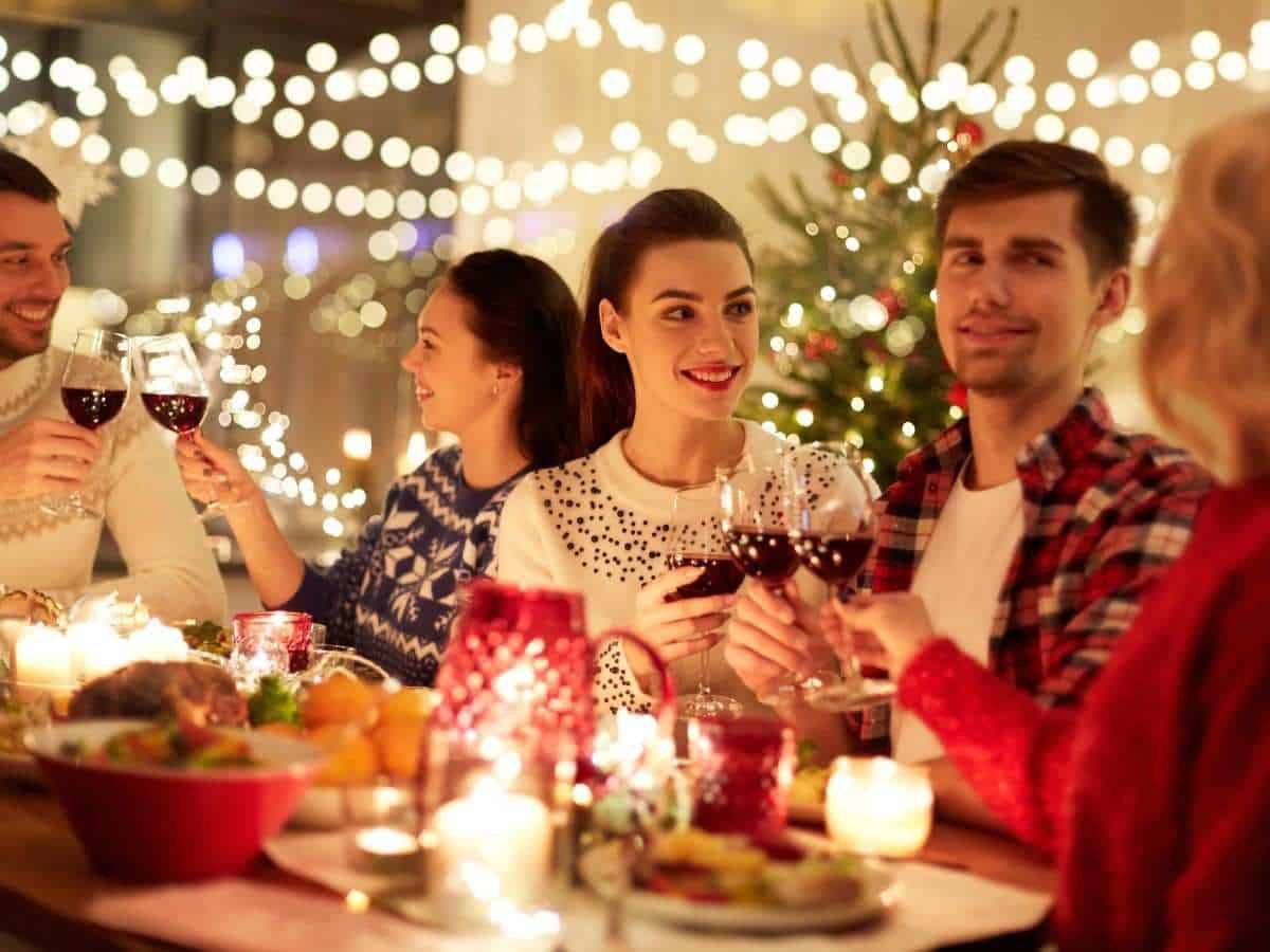 Coworkers enjoying a festive corporate holiday dinner party