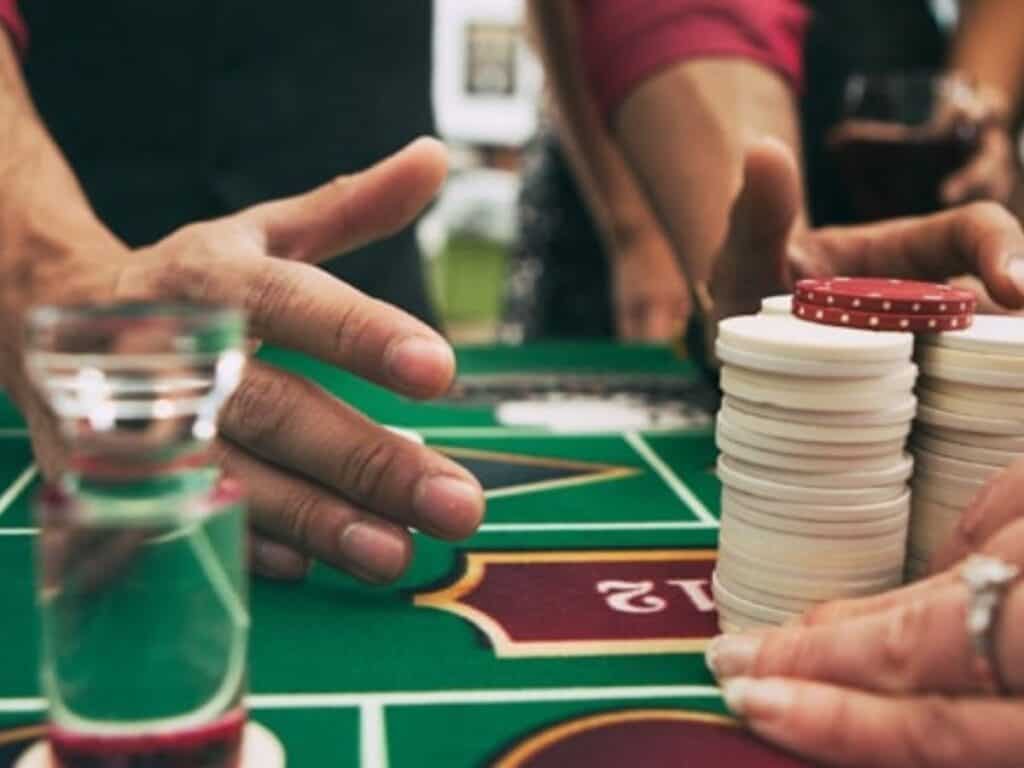 Casino night bachelor party with poker chips and table games.