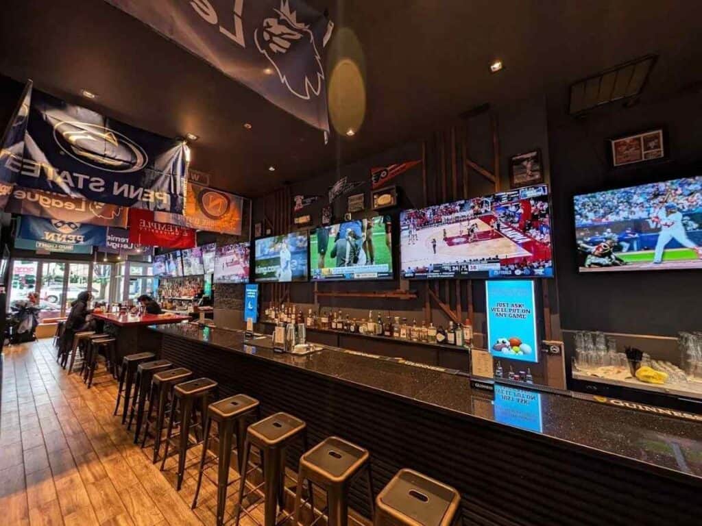 Sports bar with multiple screens for a bachelor party night out.