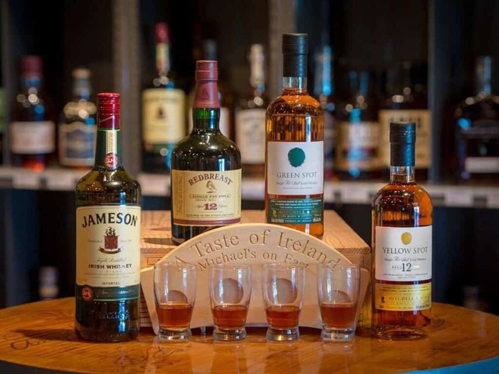 Whiskey tasting setup with assorted spirits for a bachelor party.