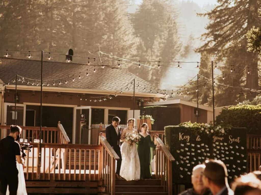 Bride and bridal party arriving at a wedding venue.