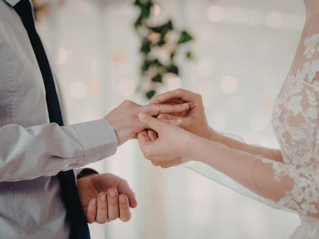 Bride and groom exchanging rings