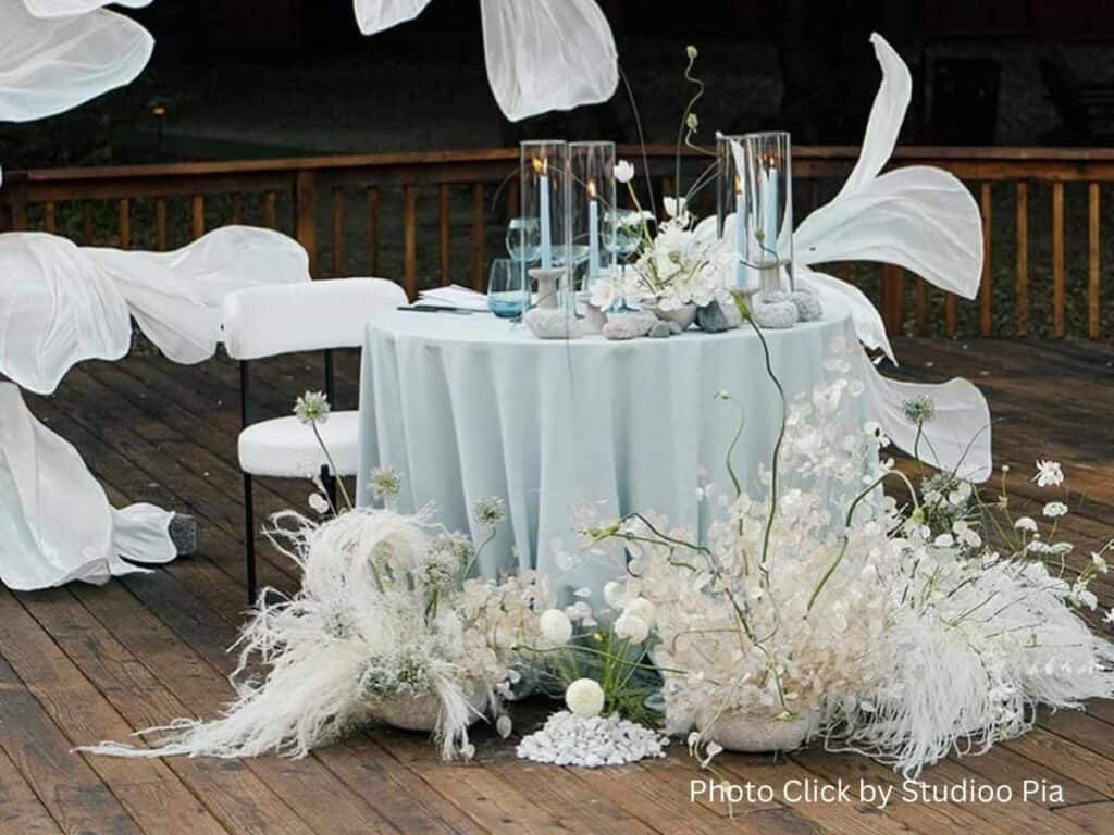 Minimalist wedding table with white flower arrangements