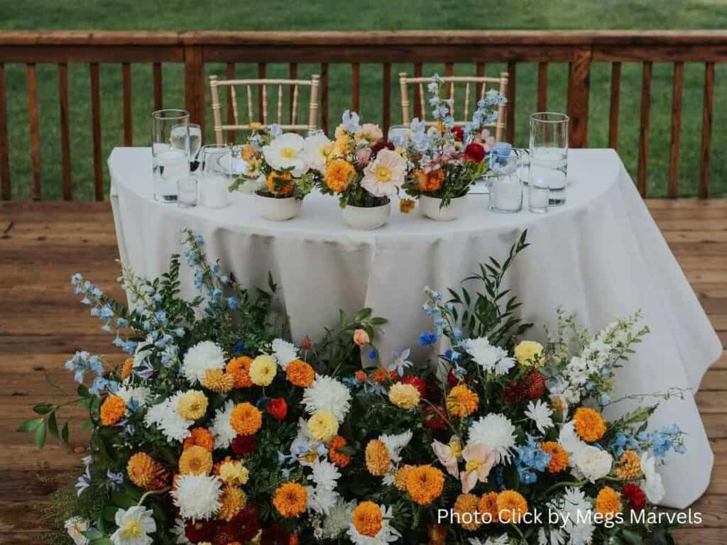 Wedding table decorated with colorful flower arrangements