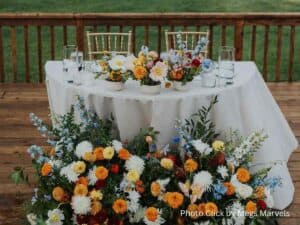 Wedding table decorated with colorful flower arrangements