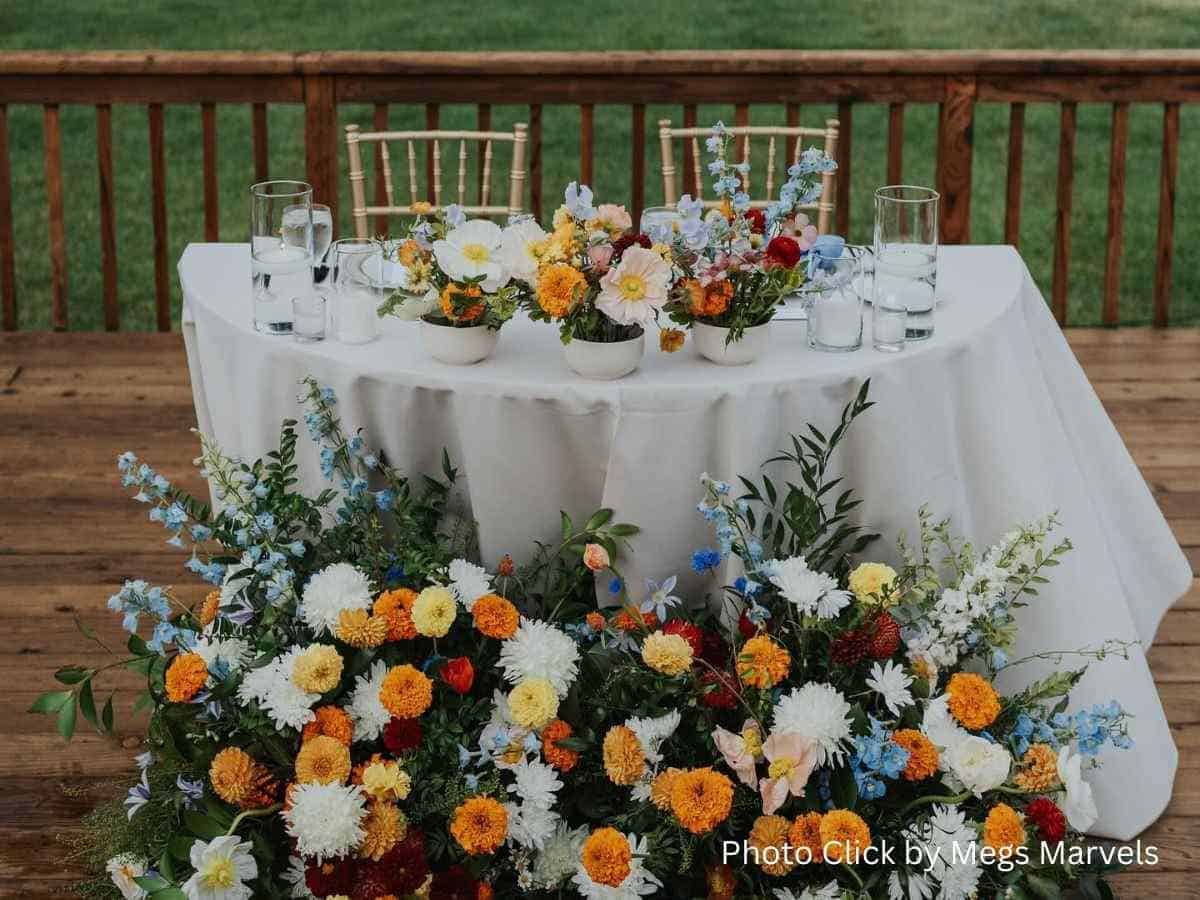 Wedding table decorated with colorful flower arrangements