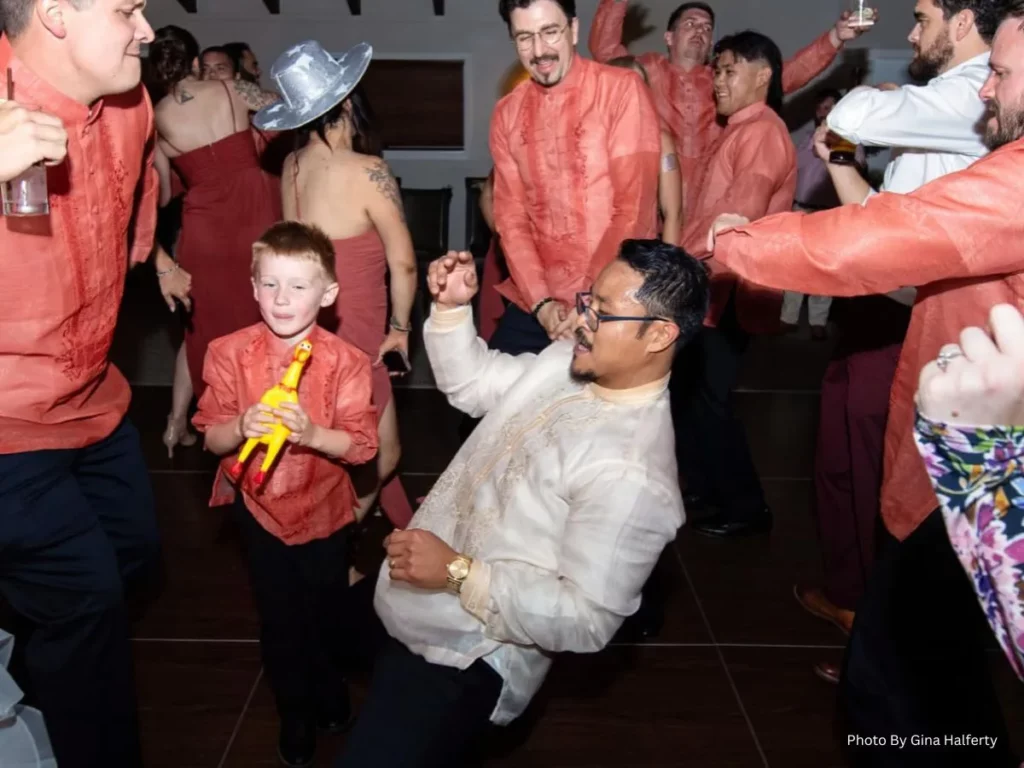 Wedding guests enjoying dancing and celebration at reception