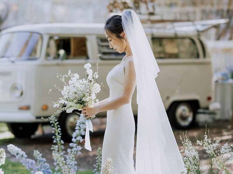 Ultra-realistic luxury bridal editorial photography of a beautif